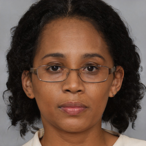 Neutral black adult female with medium  brown hair and brown eyes