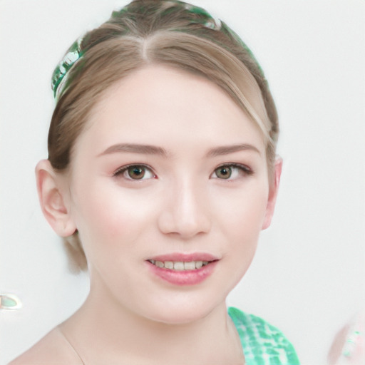 Joyful white young-adult female with short  brown hair and blue eyes