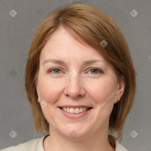 Joyful white adult female with medium  brown hair and blue eyes