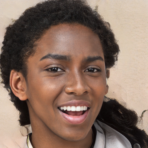 Joyful black young-adult female with long  brown hair and brown eyes