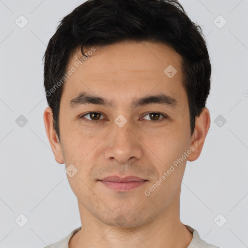 Joyful asian young-adult male with short  black hair and brown eyes