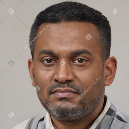 Neutral latino adult male with short  black hair and brown eyes