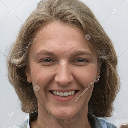 Joyful white adult female with medium  brown hair and grey eyes