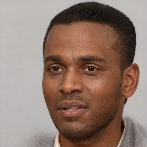 Neutral black young-adult male with short  black hair and brown eyes
