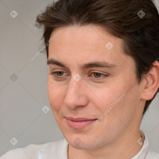 Joyful white adult male with medium  brown hair and brown eyes