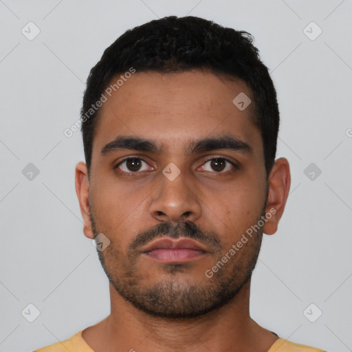 Neutral latino young-adult male with short  black hair and brown eyes