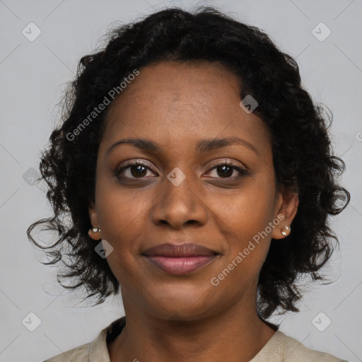Joyful black young-adult female with medium  brown hair and brown eyes