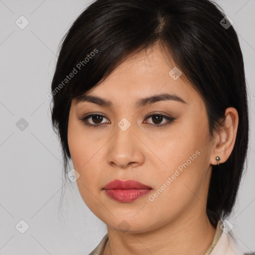 Joyful asian young-adult female with medium  brown hair and brown eyes