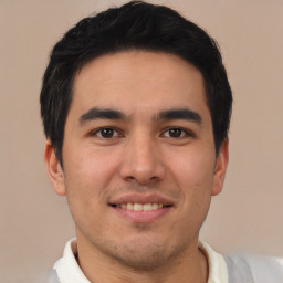 Joyful latino young-adult male with short  brown hair and brown eyes