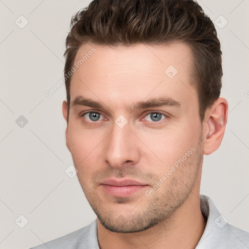 Neutral white young-adult male with short  brown hair and grey eyes