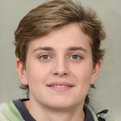 Joyful white young-adult female with medium  brown hair and blue eyes