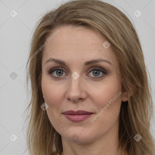 Joyful white adult female with long  brown hair and brown eyes