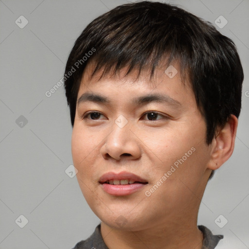 Joyful asian young-adult male with short  black hair and brown eyes