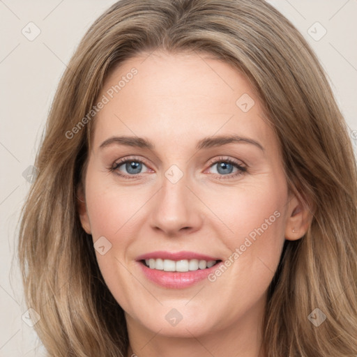 Joyful white young-adult female with long  brown hair and grey eyes