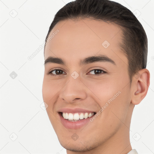 Joyful white young-adult male with short  brown hair and brown eyes