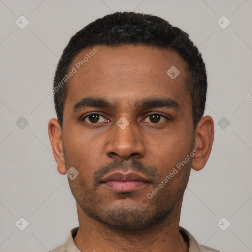 Neutral latino young-adult male with short  black hair and brown eyes