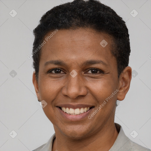 Joyful latino young-adult male with short  brown hair and brown eyes