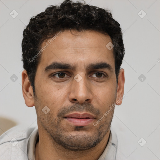Neutral white young-adult male with short  black hair and brown eyes