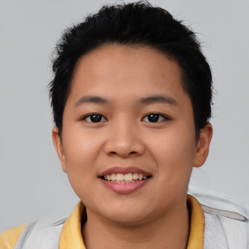 Joyful asian young-adult female with short  brown hair and brown eyes