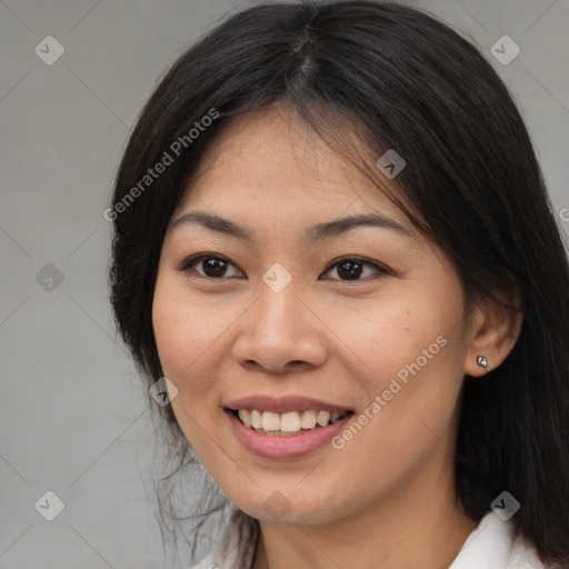 Joyful asian young-adult female with long  brown hair and brown eyes