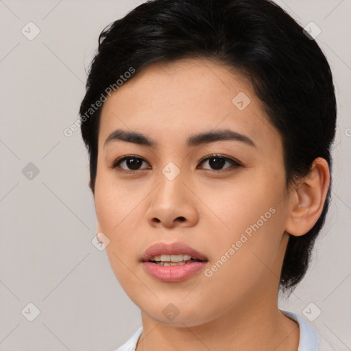 Joyful asian young-adult female with medium  black hair and brown eyes