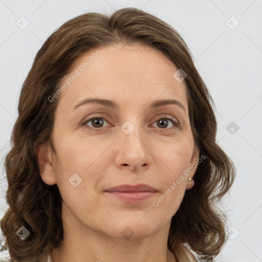 Joyful white adult female with medium  brown hair and grey eyes