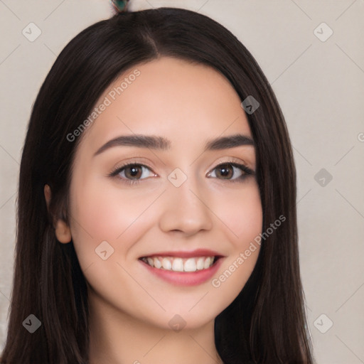 Joyful white young-adult female with long  black hair and brown eyes