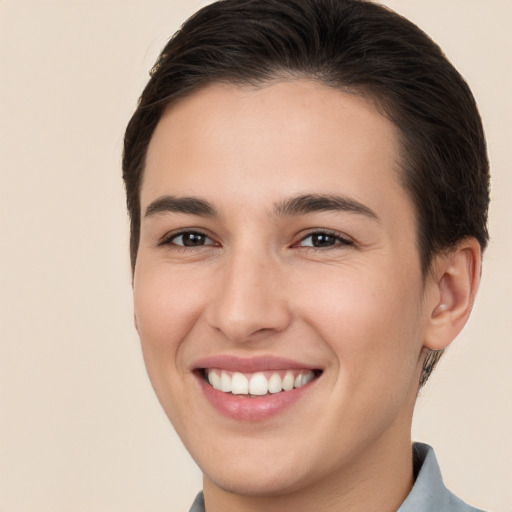 Joyful white young-adult female with short  brown hair and brown eyes