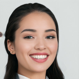 Joyful white young-adult female with long  black hair and brown eyes