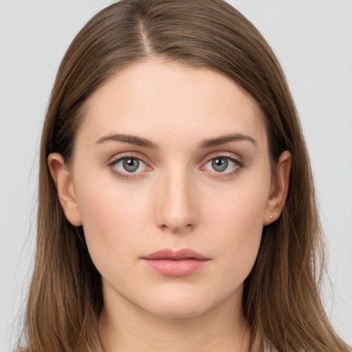 Neutral white young-adult female with long  brown hair and brown eyes