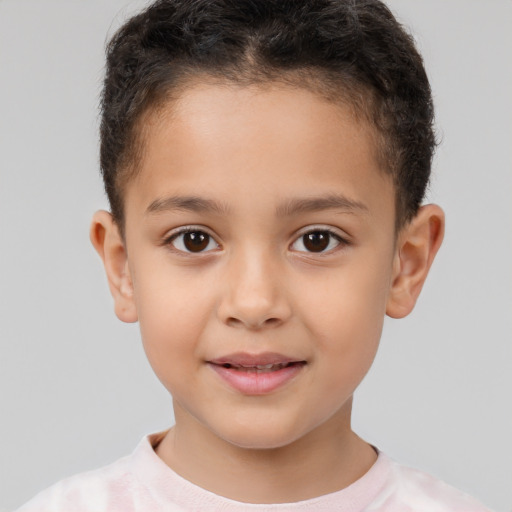 Joyful white child male with short  brown hair and brown eyes