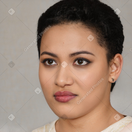 Joyful latino young-adult female with short  black hair and brown eyes