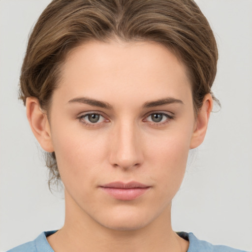 Neutral white young-adult female with short  brown hair and brown eyes