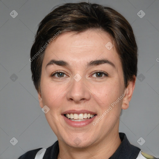 Joyful white adult female with medium  brown hair and brown eyes