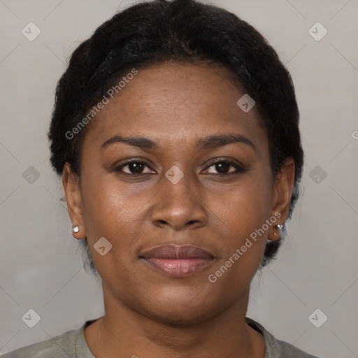 Joyful black young-adult female with short  brown hair and brown eyes