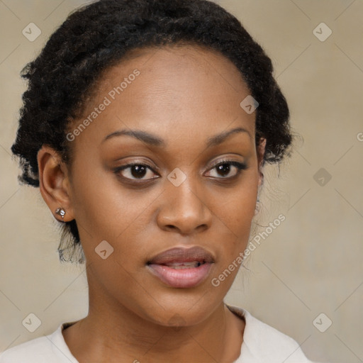 Joyful black young-adult female with medium  brown hair and brown eyes