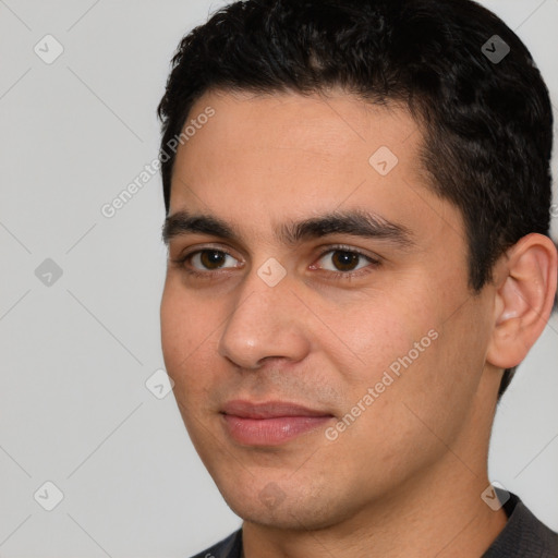 Joyful white young-adult male with short  black hair and brown eyes