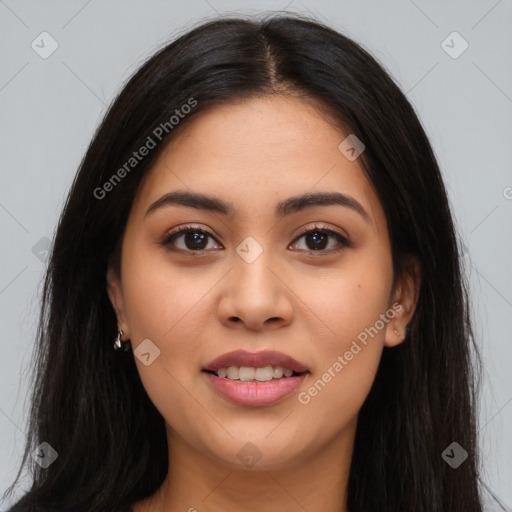 Joyful latino young-adult female with long  black hair and brown eyes