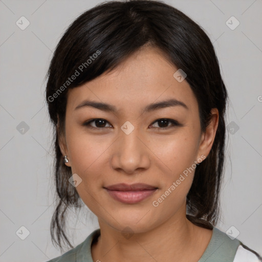 Joyful asian young-adult female with medium  black hair and brown eyes