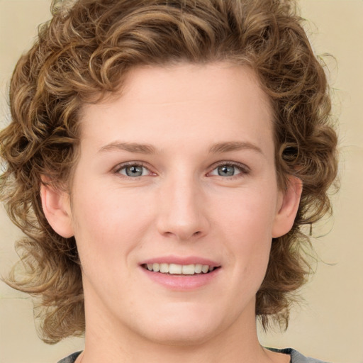 Joyful white young-adult female with medium  brown hair and green eyes