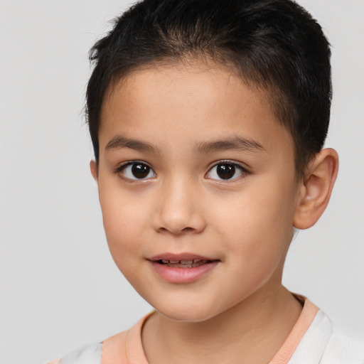 Joyful white child female with short  brown hair and brown eyes