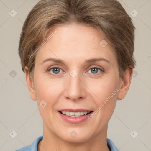 Joyful white adult female with short  brown hair and grey eyes