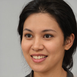 Joyful asian young-adult female with medium  brown hair and brown eyes