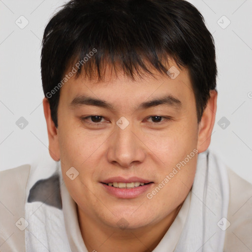 Joyful asian young-adult male with short  brown hair and brown eyes