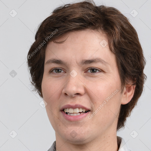 Joyful white adult male with medium  brown hair and brown eyes