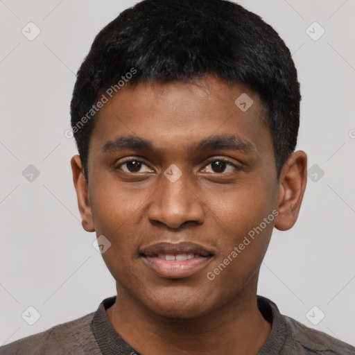Joyful black young-adult male with short  black hair and brown eyes