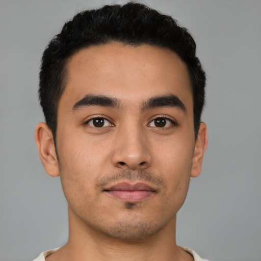 Neutral latino young-adult male with short  black hair and brown eyes