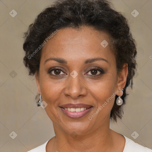 Joyful black adult female with short  brown hair and brown eyes