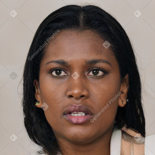 Neutral black young-adult female with medium  black hair and brown eyes