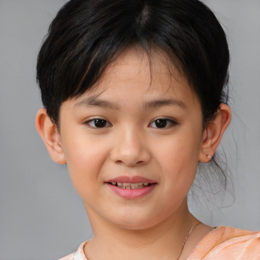 Joyful white child female with short  brown hair and brown eyes